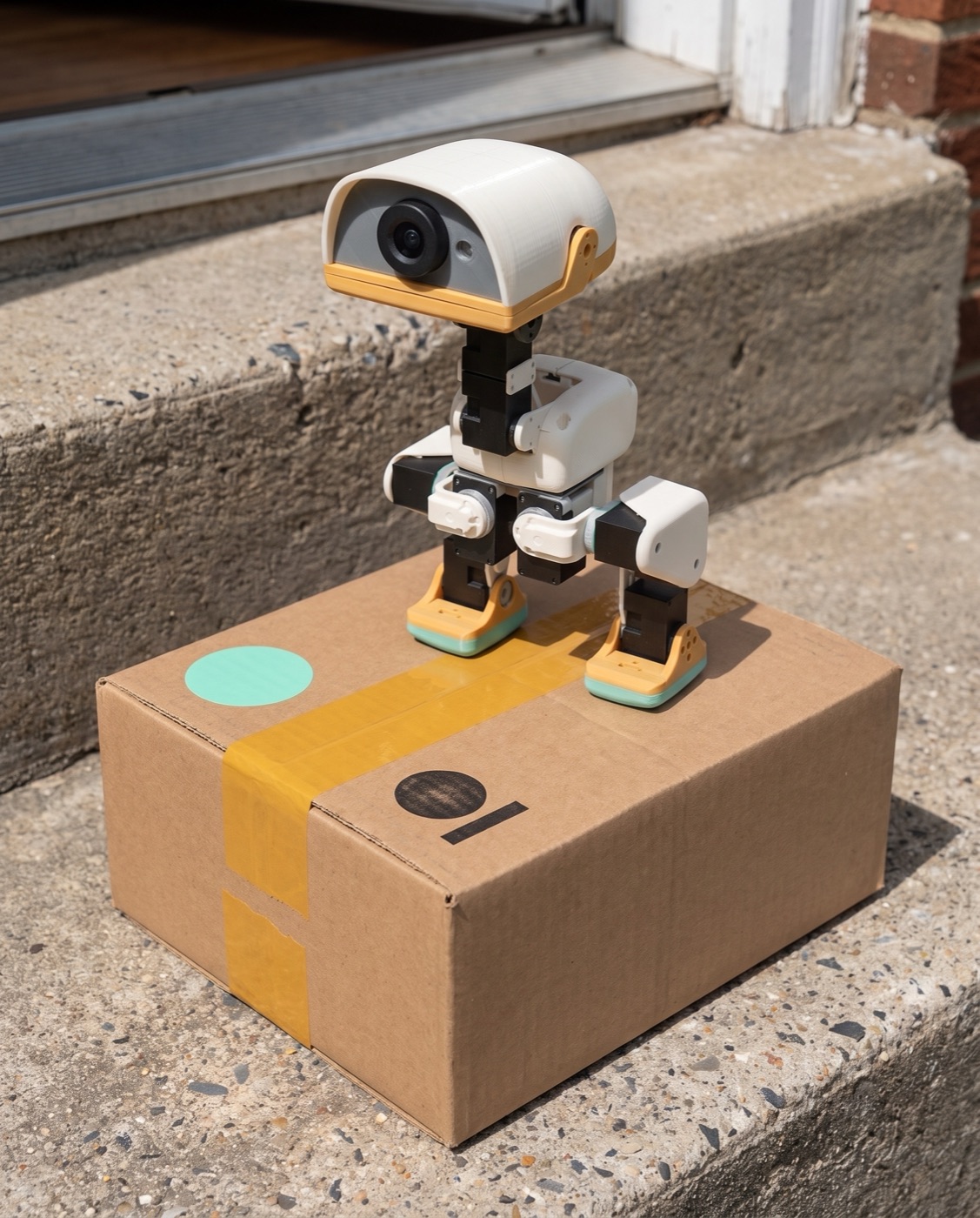 Concept: outer shipping carton with amber tape and a mint sticker
